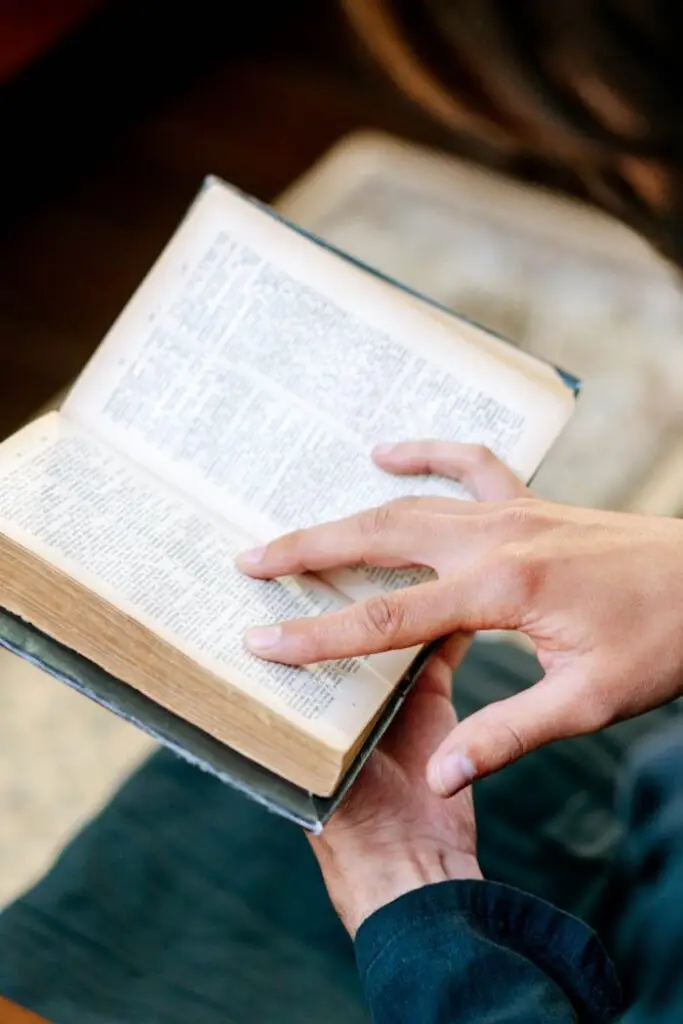 Person Reading a Holy Bible